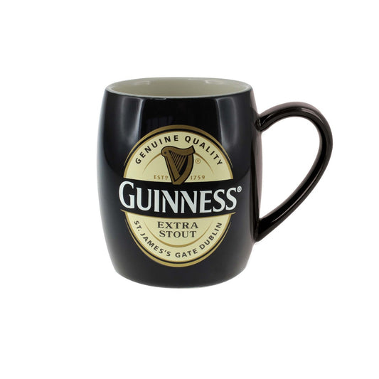 A Guinness Label Barrel Mug with the Guinness logo.