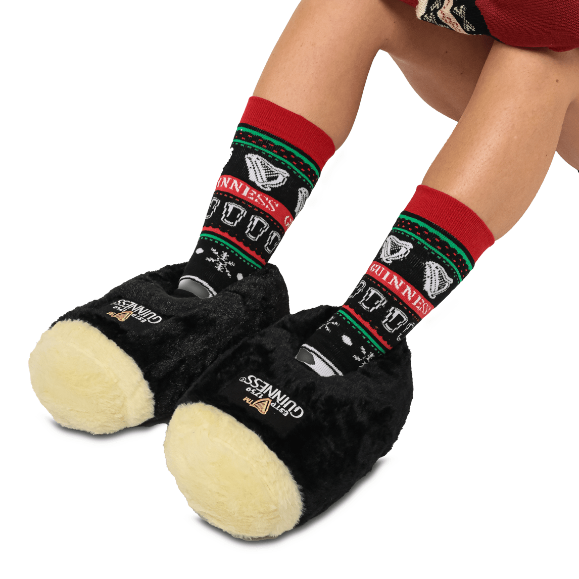 A woman wearing a pair of Guinness Pint Slippers.
