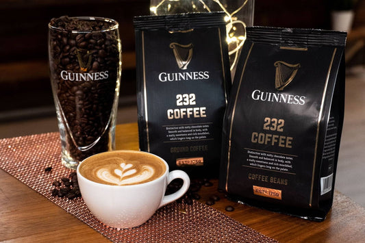 Description: A cup of Guinness UK Ground Coffee 227g on a table, perfect for enjoying while watching rugby.