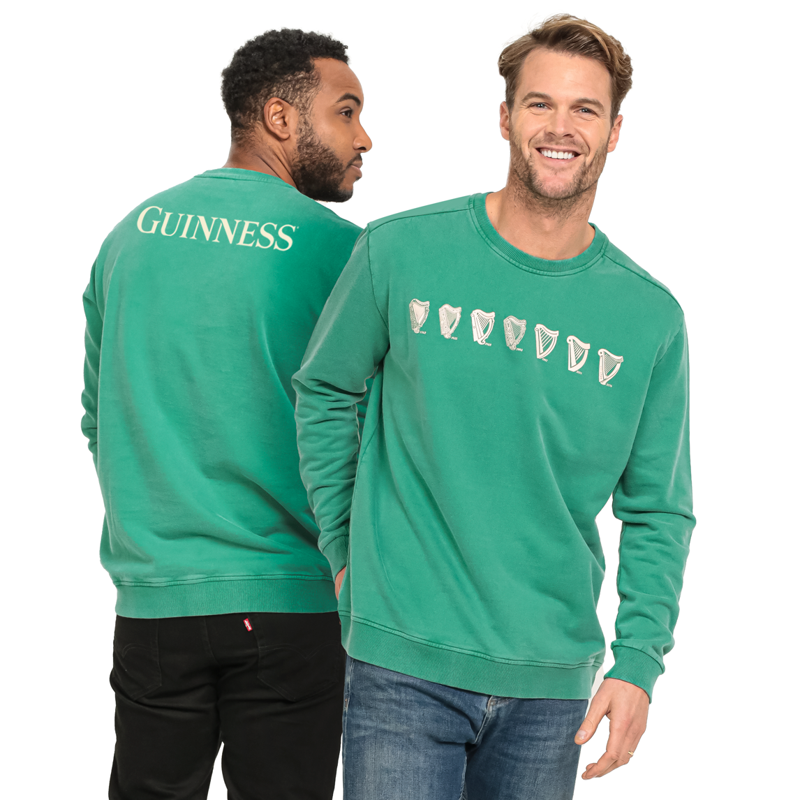 A man wearing a green Guinness Evolution Harp Green sweatshirt.