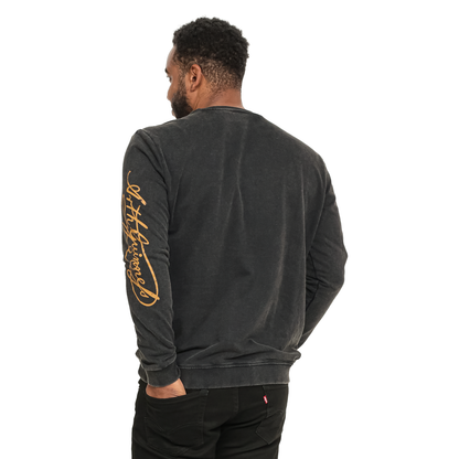 The back of a man wearing a cozy Guinness Harp Sweatshirt - Black Distressed Gold with gold lettering from Guinness UK.