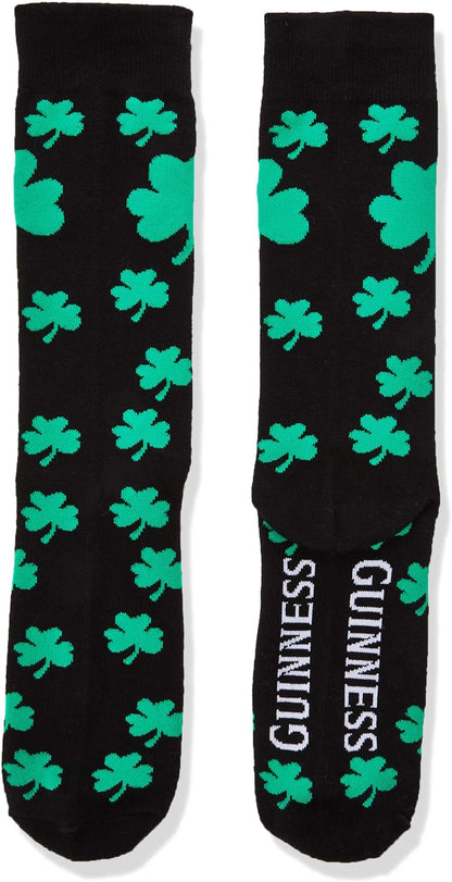 A pair of black crew socks featuring green shamrock patterns and the word "Guinness" printed in white at the foot area, celebrating the Irish charm of Guinness's brewing legacy.