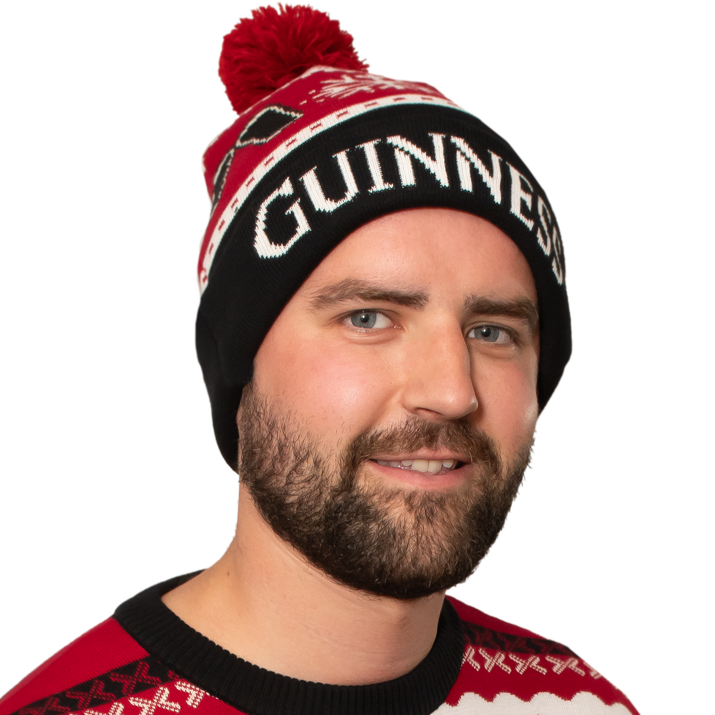 A sustainable man wearing an Official Guinness Christmas beanie from Guinness UK.