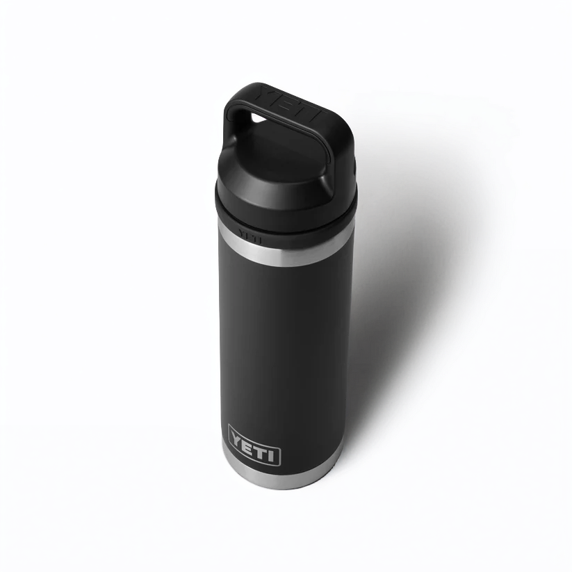 The Guinness Six Nations - Yeti 18oz Chug Bottle in black from Guinness Webstore UK, shown with closed lid and handle on a white background, is an ideal accessory for rugby fans supporting the Guinness Six Nations.
