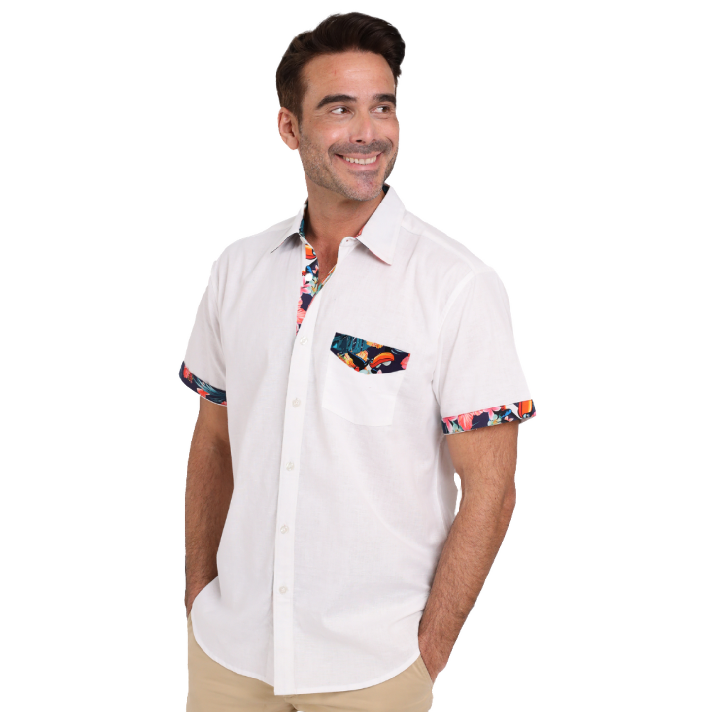 A man wearing a Guinness White Linen Summer Shirt from the Guinness Webstore UK with colorful trim on the collar, pocket, and sleeves smiles while looking to the side.