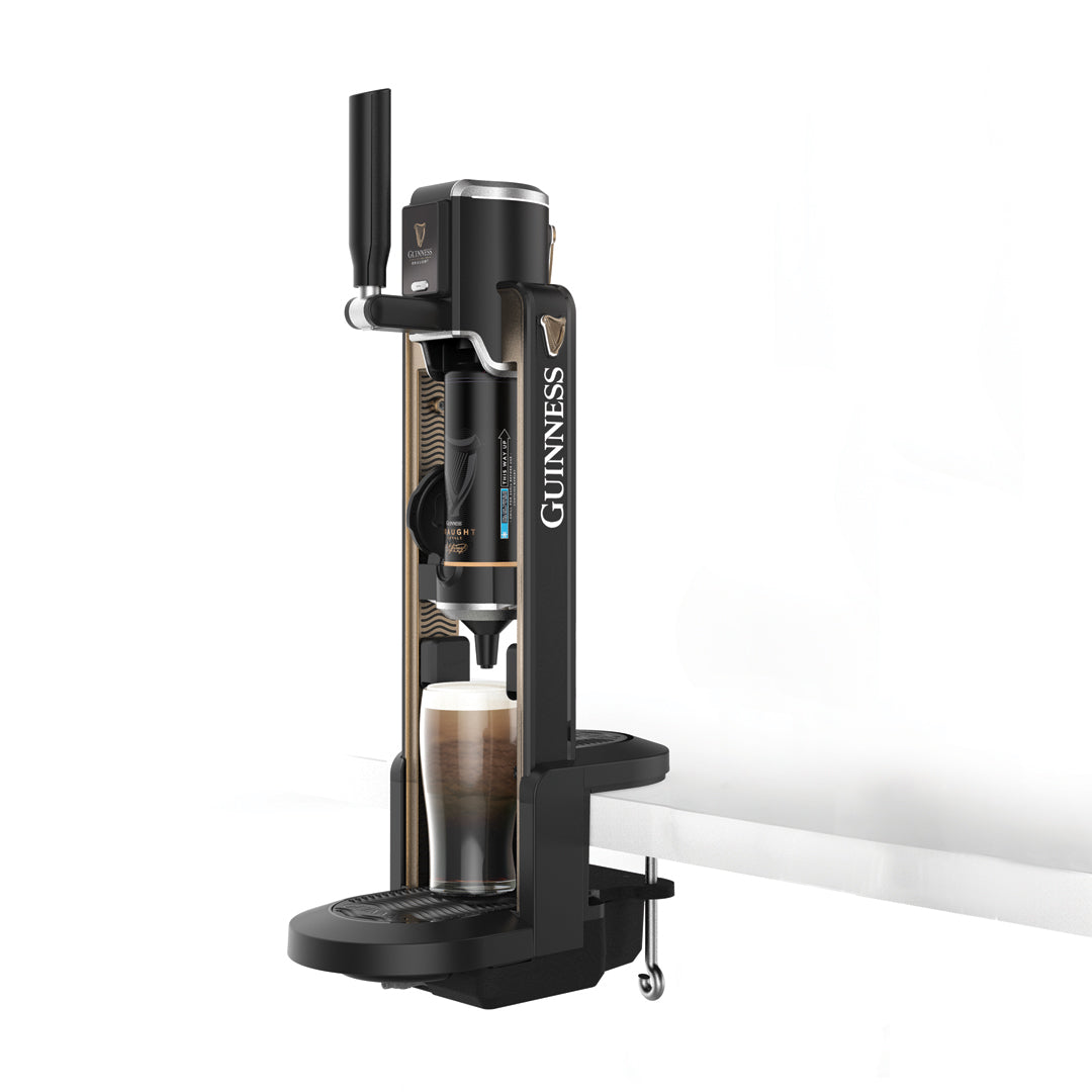 A black Guinness UK MicroDraught beer dispenser with a stout glass being filled, set against a plain background, makes the perfect addition to any home bar.