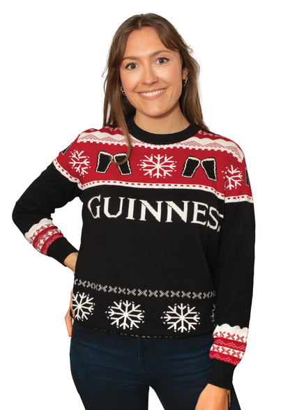 A festive woman sporting an Official Guinness Christmas Jumper.