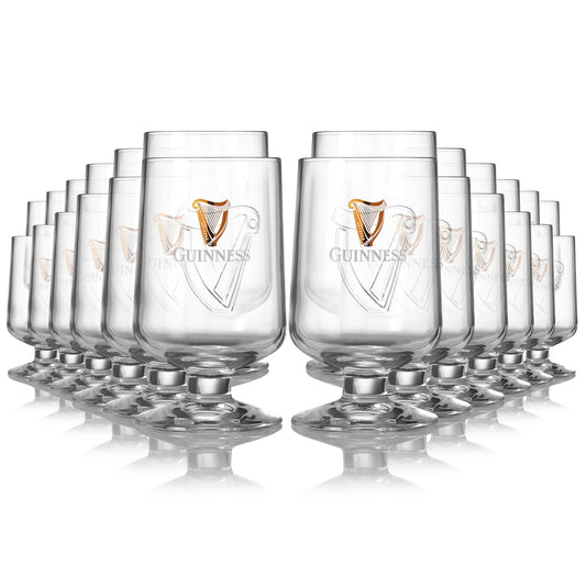 A set of Guinness Embossed Stem Glass 420ml - 24 Pack half pint glasses on a white background. (Brand: Guinness UK)