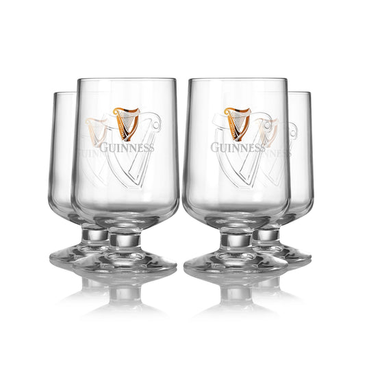 Four Guinness Embossed Stem Glasses on a white background.