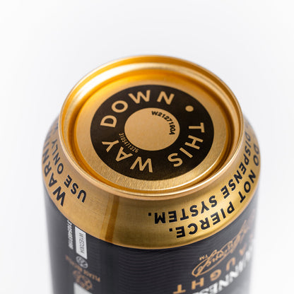 A can of Guinness MicroDraught Stout Beer Cans with a gold label on it.