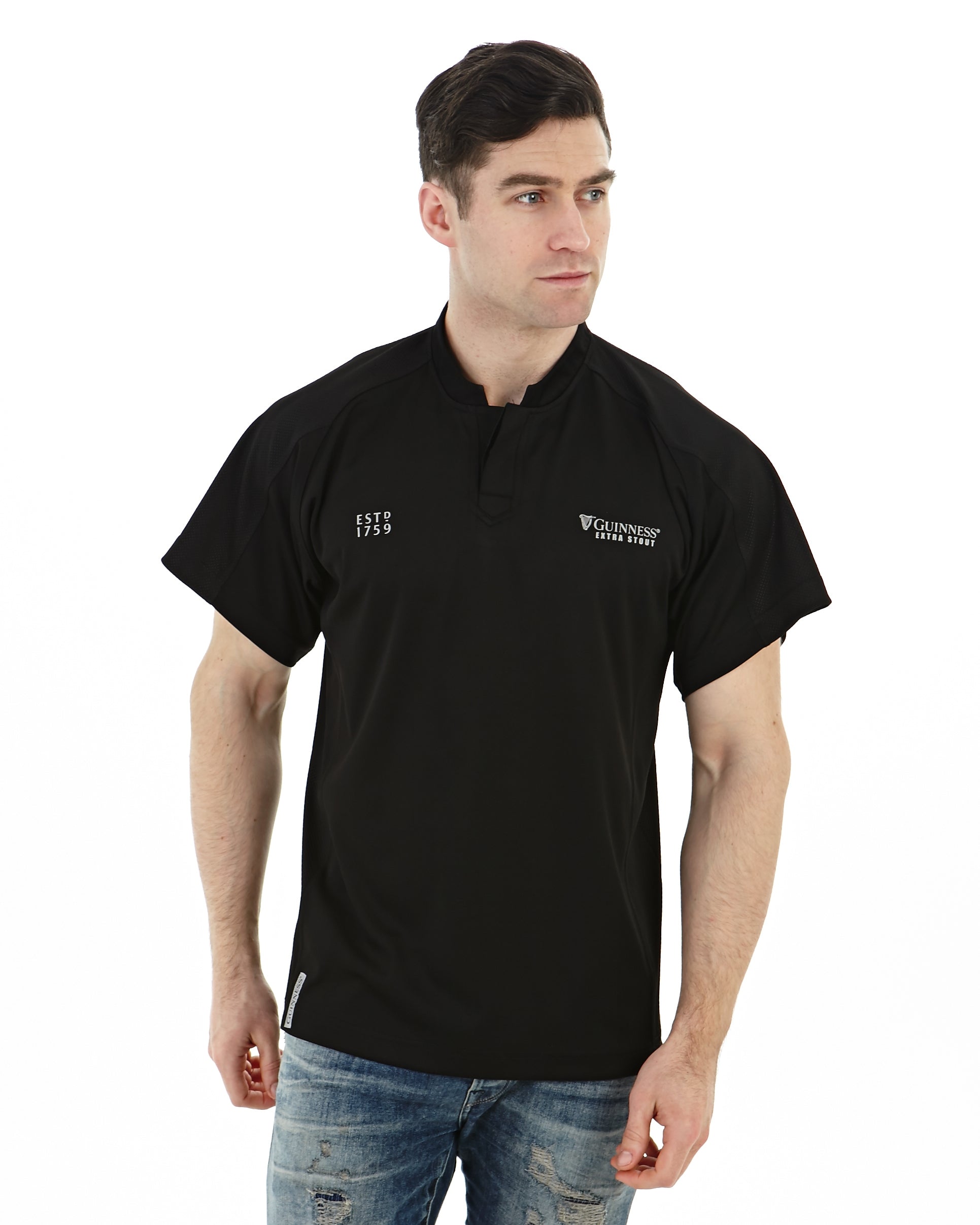 An individual wearing a Guinness All Black Rugby Jersey.