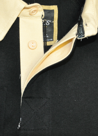 A close up of a Guinness Traditional Rugby Jersey polo shirt, made of cotton.