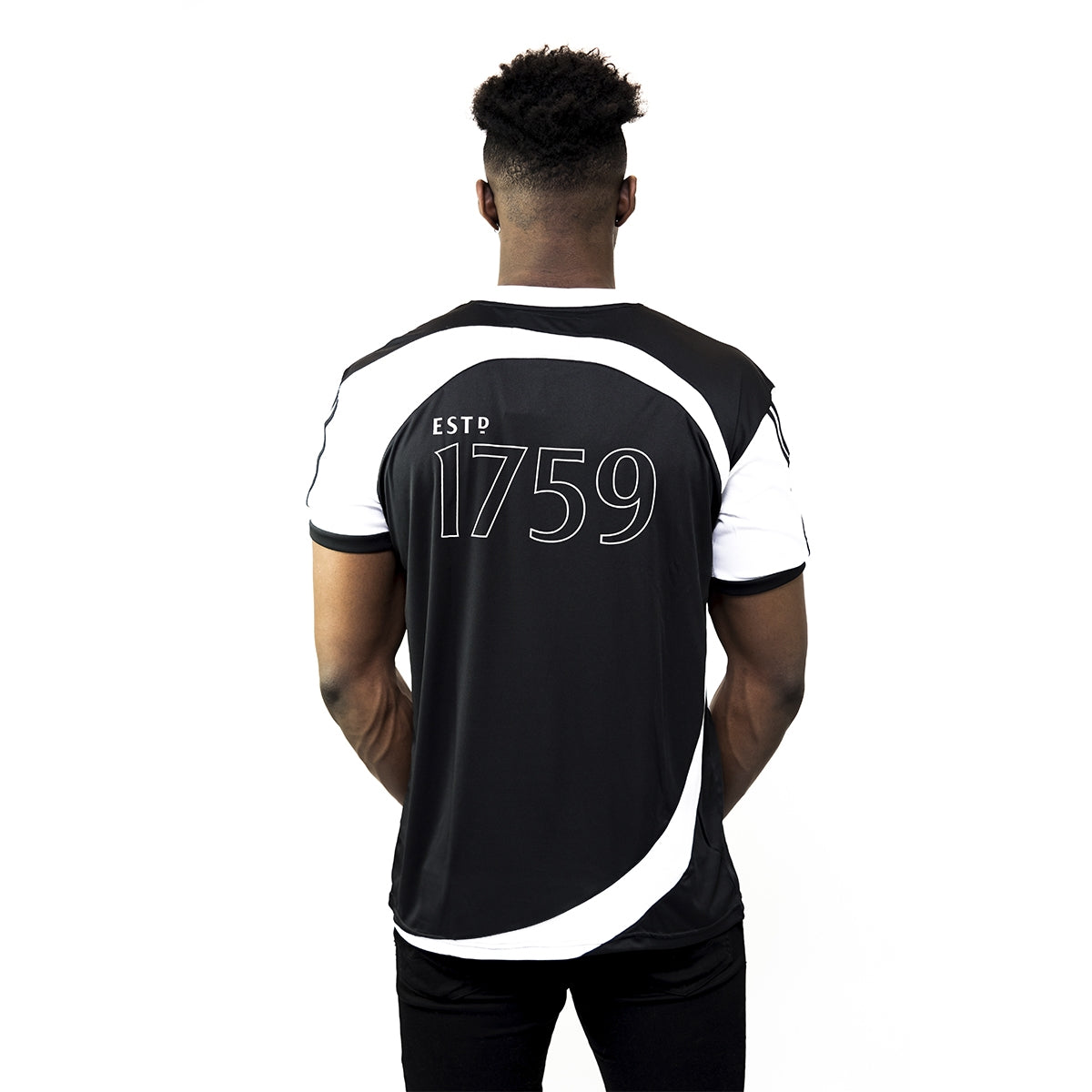 The back of a man wearing a Guinness® Soccer Jersey.