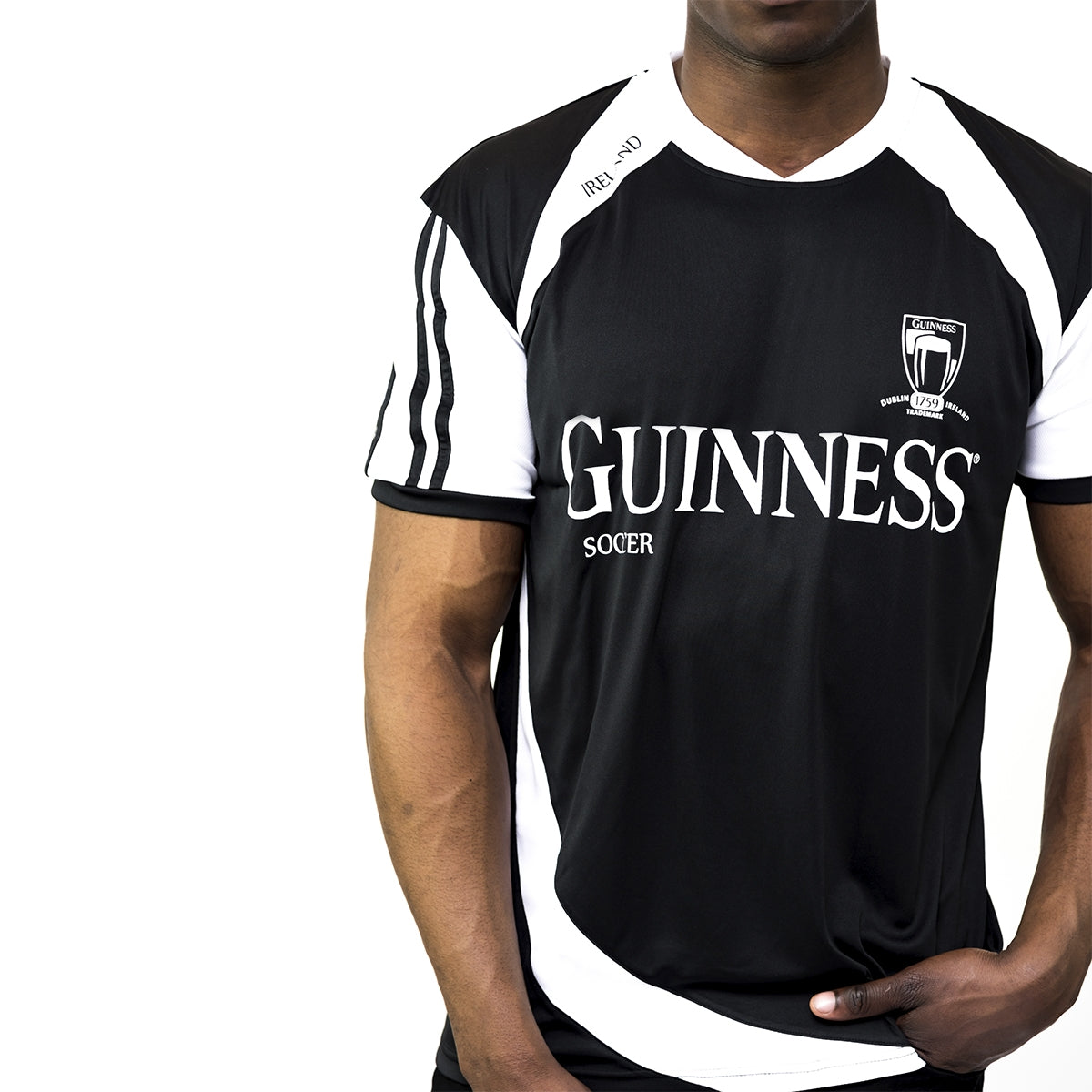 A man wearing a Guinness® Soccer Jersey.