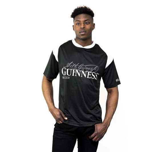 A Guinness enthusiast wearing a Black & White Sublimated Soccer Jersey with Arthur Guinness Signature from Guinness.