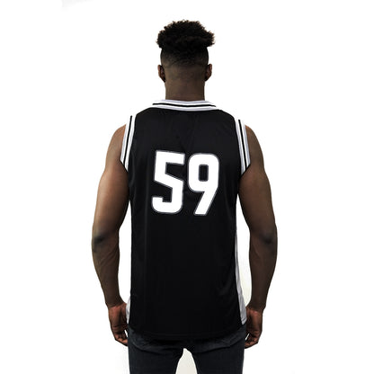 The back of a basketball fan wearing a Guinness UK Black and Grey Basketball Jersey.