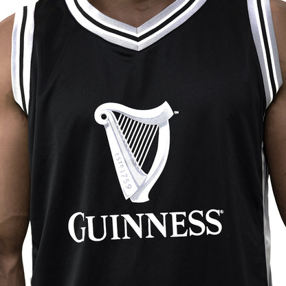 A basketball fan wearing a Guinness UK Black and Grey Basketball Jersey.