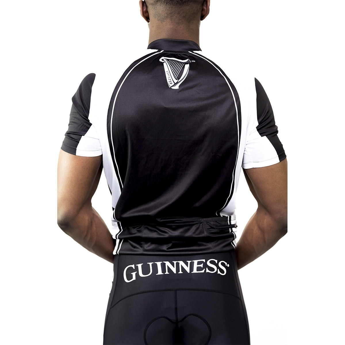 The back of a man wearing a Guinness UK Performance Cycling Jersey made of polyester.