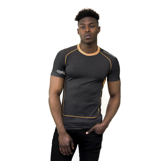 A man wearing a Guinness UK gym compression top.