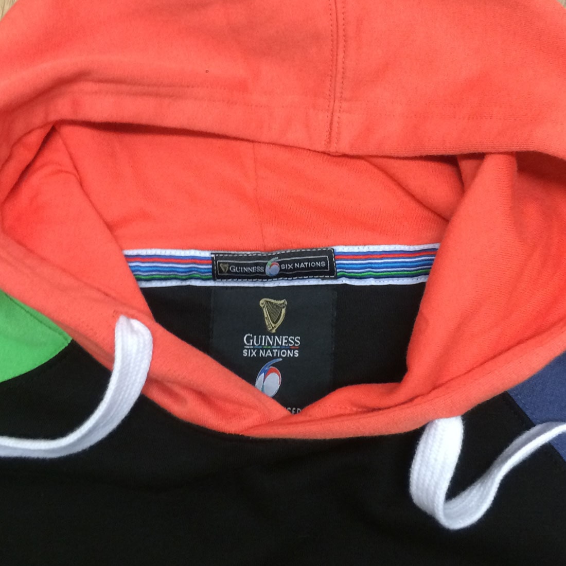 A close up of a Guinness UK Six Nations Colour Block Hoodie.