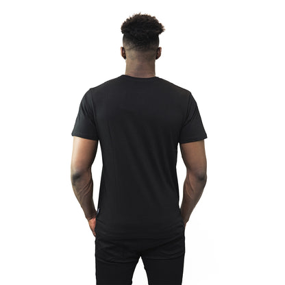 The back of a man wearing a Guinness® Distressed T-Shirt.