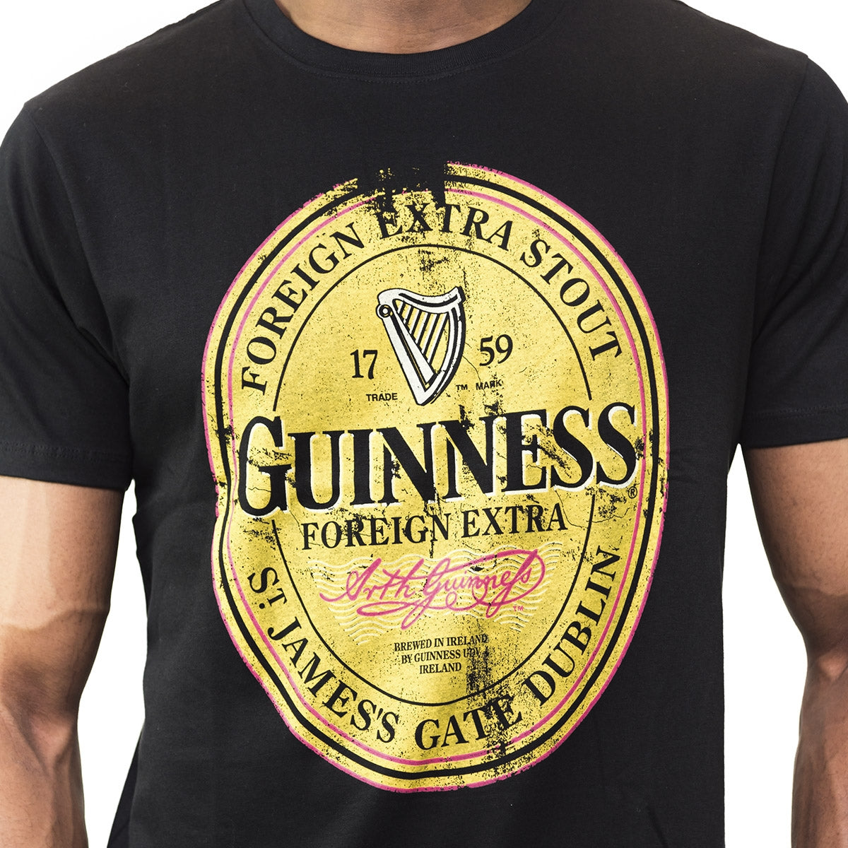 A man wearing a Guinness Distressed T-Shirt.