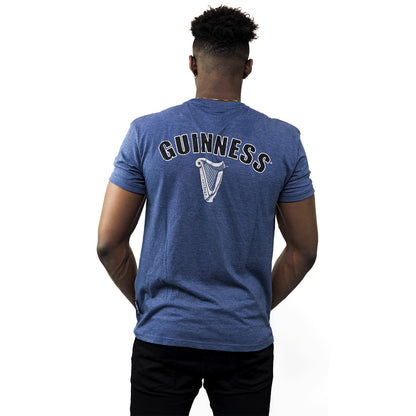 The back of a man wearing a Guinness UK Navy Heathered EST 1759 T-shirt.