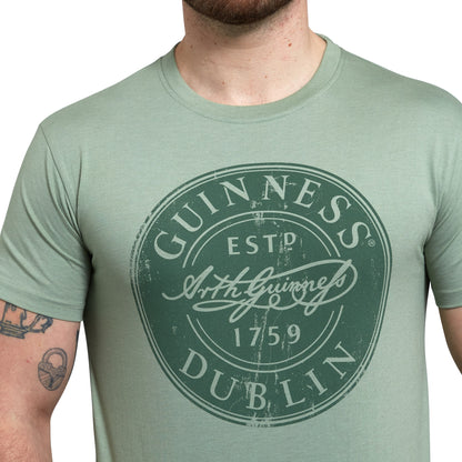 Guinness Green Bottle Cap T-Shirt featuring a unique bottle cap design.