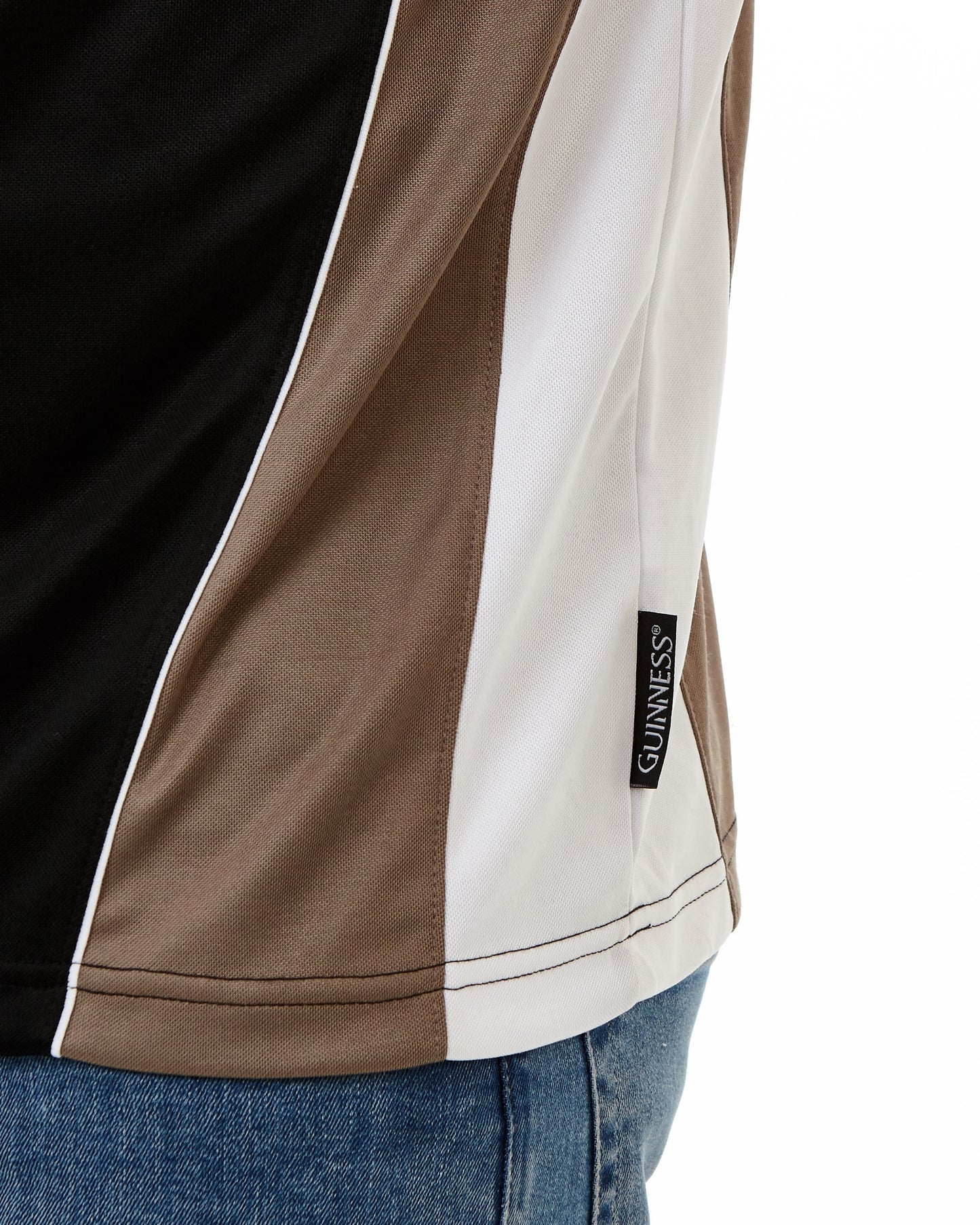 The back view of a man wearing a Guinness Performance Panelled Golf Shirt made with moisture wicking fabric by Guinness UK.