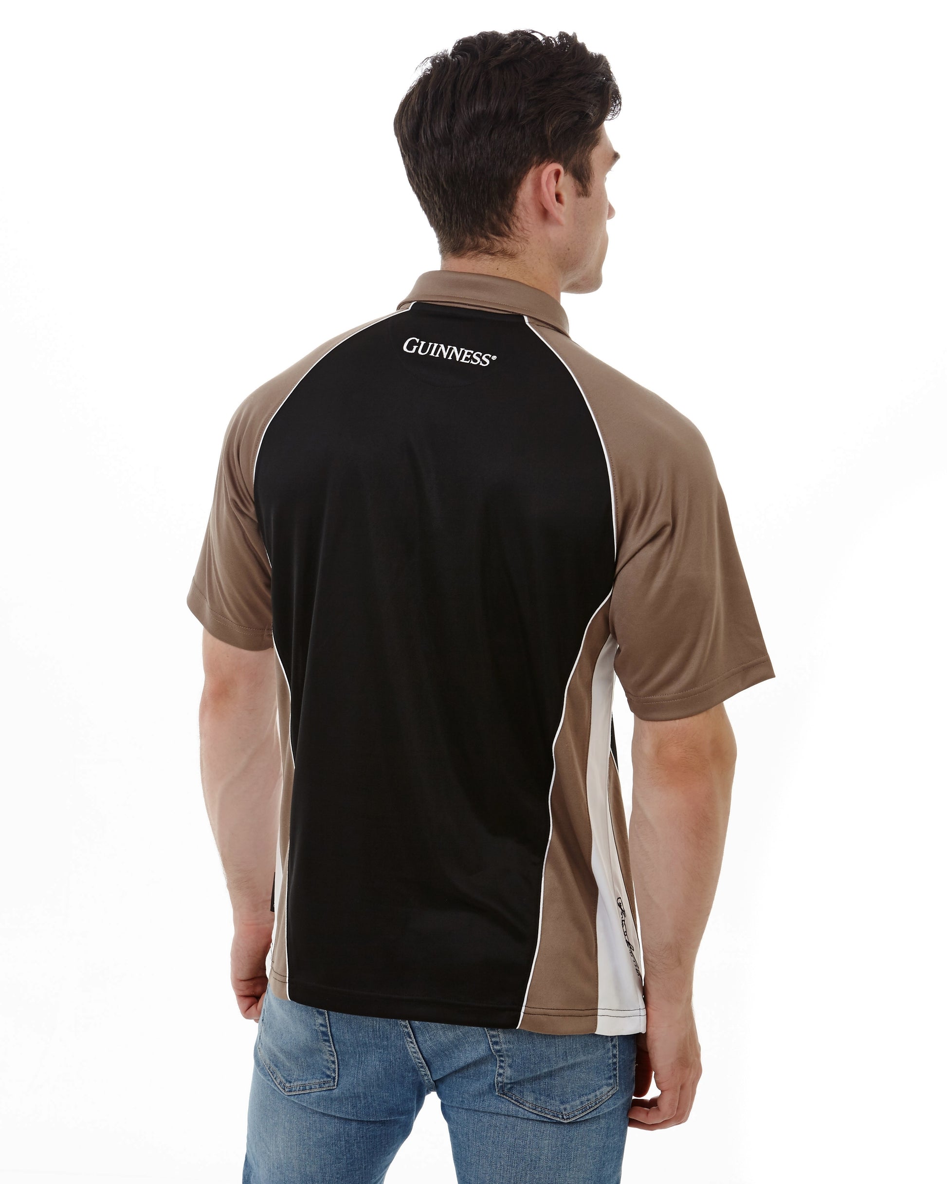 The back view of a man wearing a Guinness UK performance panelled golf shirt.