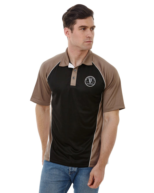 A man wearing a black and tan Guinness Performance Panelled Golf Shirt made of moisture-wicking fabric from Guinness UK.