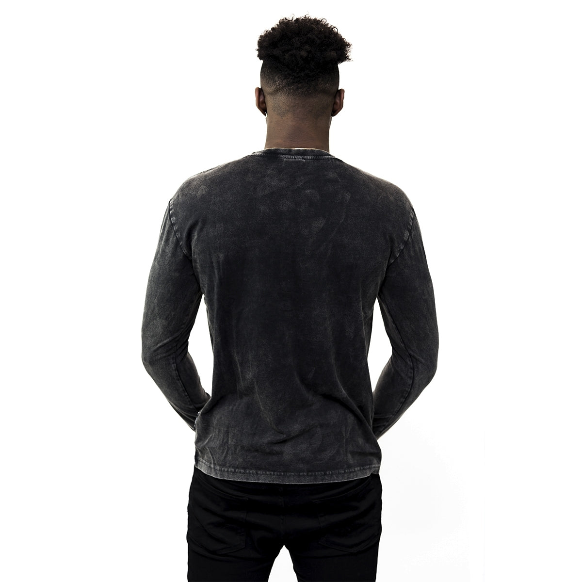 The back view of a man wearing a black Guinness UK Classic Henley t-shirt.
