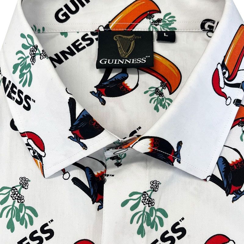 The Guinness Christmas Toucan Shirt, from the Guinness Webstore UK, features a festive toucan with colorful mistletoe and "Guinness" text, making it an ideal gift for any fan.