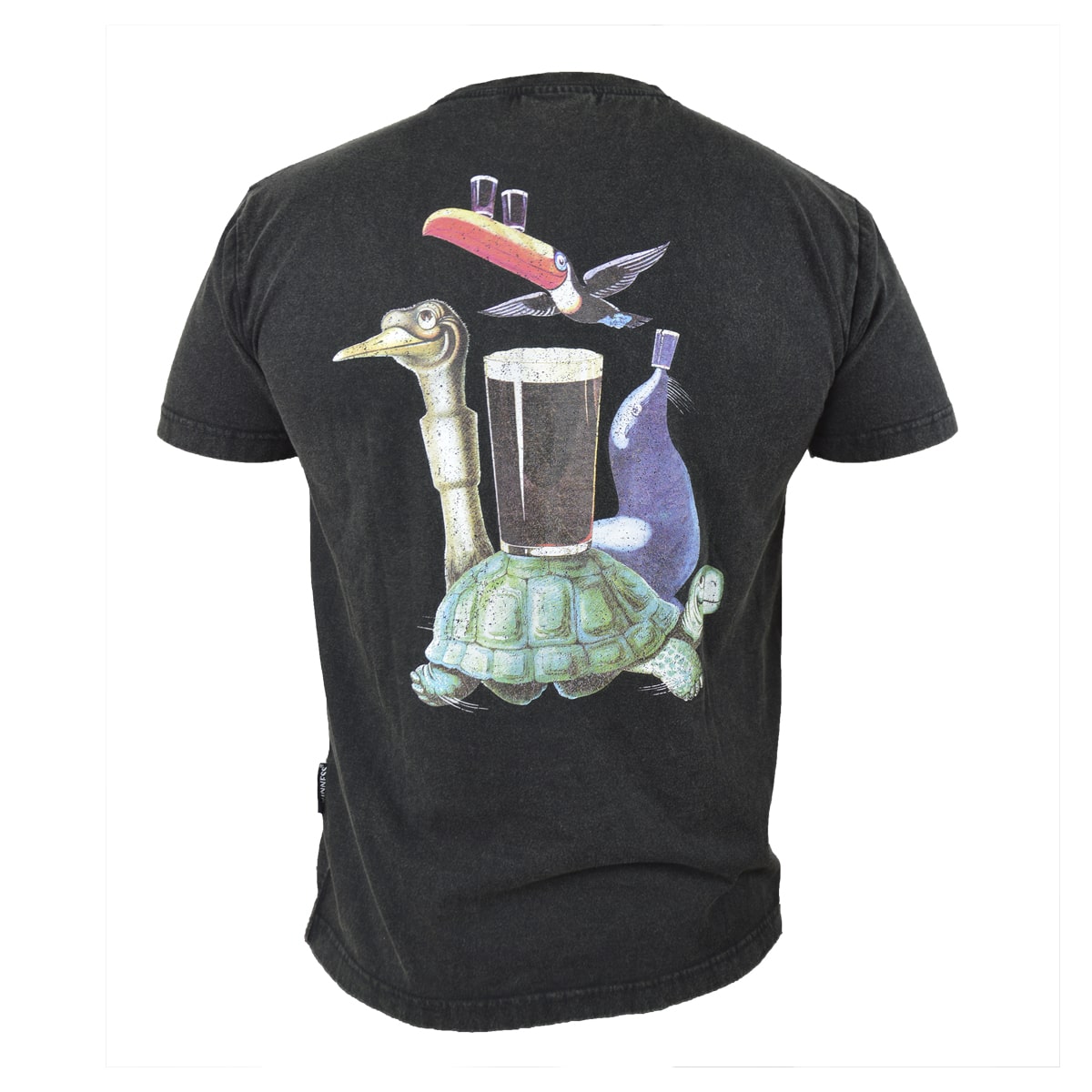The "Guess Who" Tee by Guinness UK is a black T-shirt featuring a back graphic of a pelican, turtle, and the iconic Guinness Guess Who Toucan balancing a pint of beer. Inspired by the illustrators of Gilroy Guinness, this tee offers relaxed style with its distressed finish.