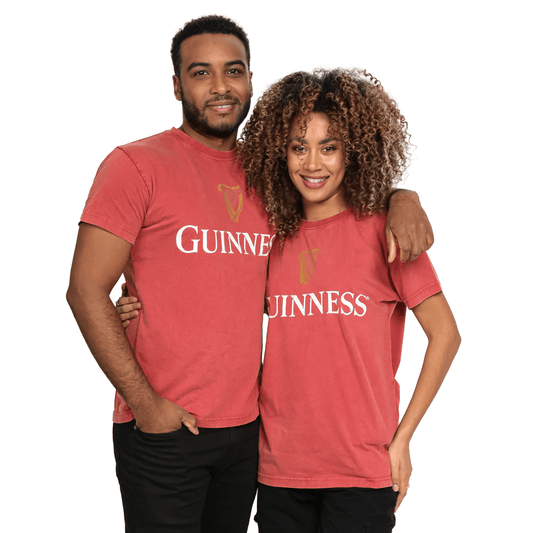 Premium Guinness UK t-shirts are being worn by a couple.