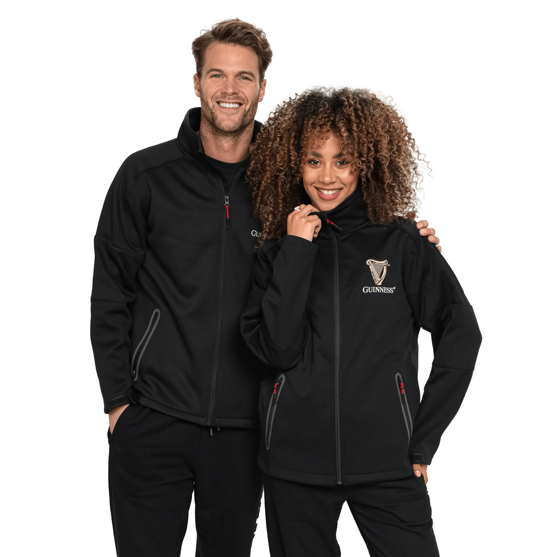 A man and woman posing for a photo in a Guinness UK waterproof jacket.