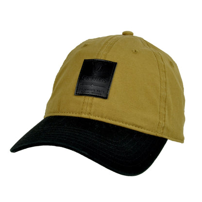 A Guinness Premium Camel & Black with Black Leather Patch Cap trucker hat with an adjustable size. (Brand: Guinness UK)