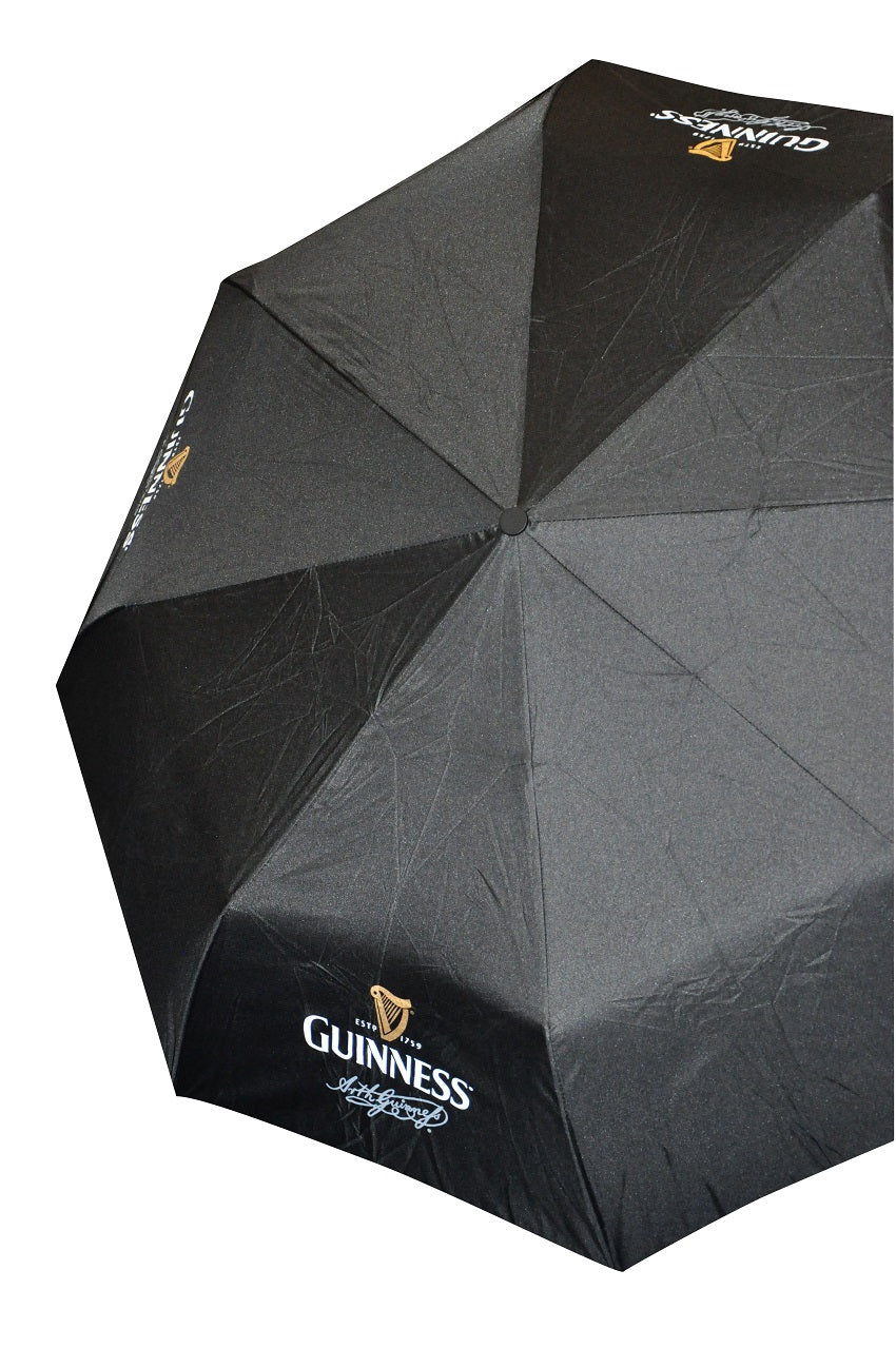 A black folding Guinness Gents Contemporary Umbrella with a Guinness logo, perfect for rainy days.