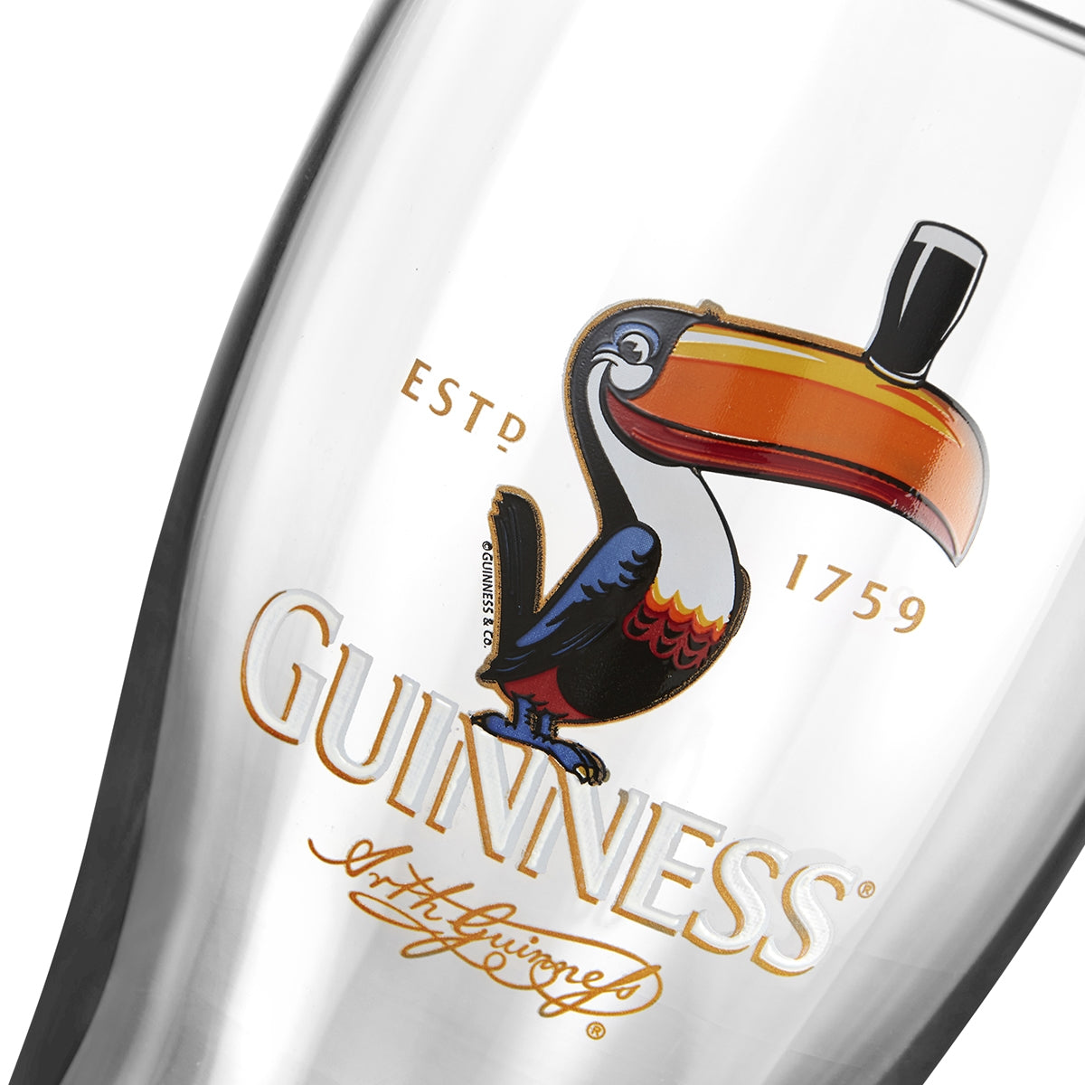 Iconic Guinness UK Toucan Pint Glass - 12 Pack featuring a toucan on it.