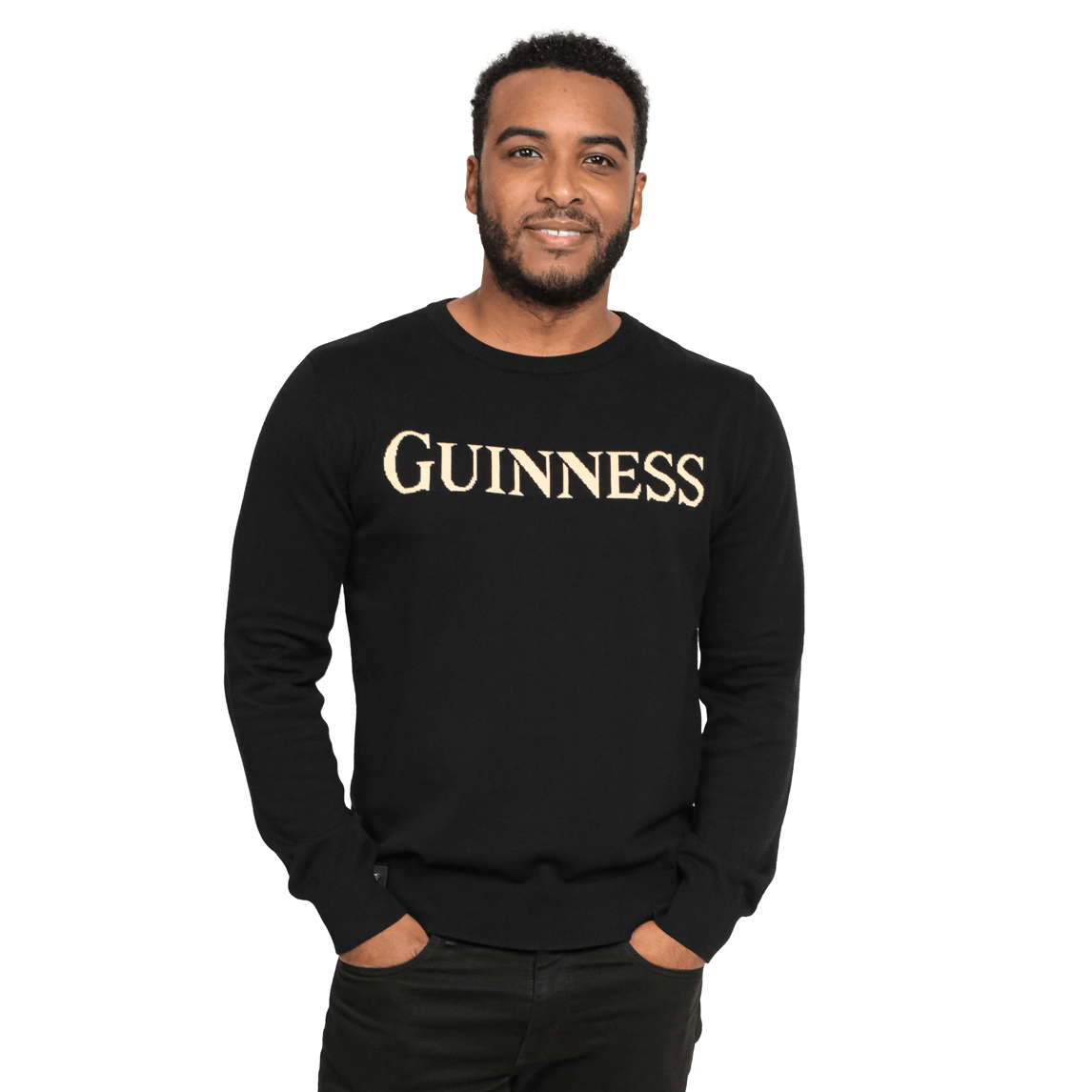 A man wearing a black 100% Organic Cotton Jumper with the brand name Guinness UK on it.