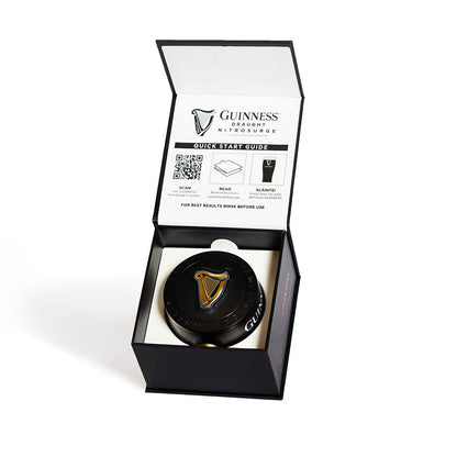 A Guinness Nitrosurge Unit in a box with the Guinness UK logo on it.