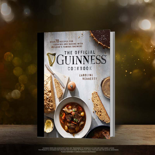 The official Guinness UK Hardcover Cookbook, filled with delicious recipes, sitting on a table.