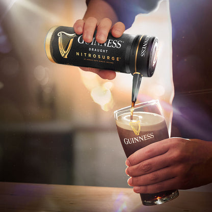 Using the Guinness Nitrosurge Unit, a person is gracefully pouring Guinness UK into a glass, emphasizing the pouring experience.