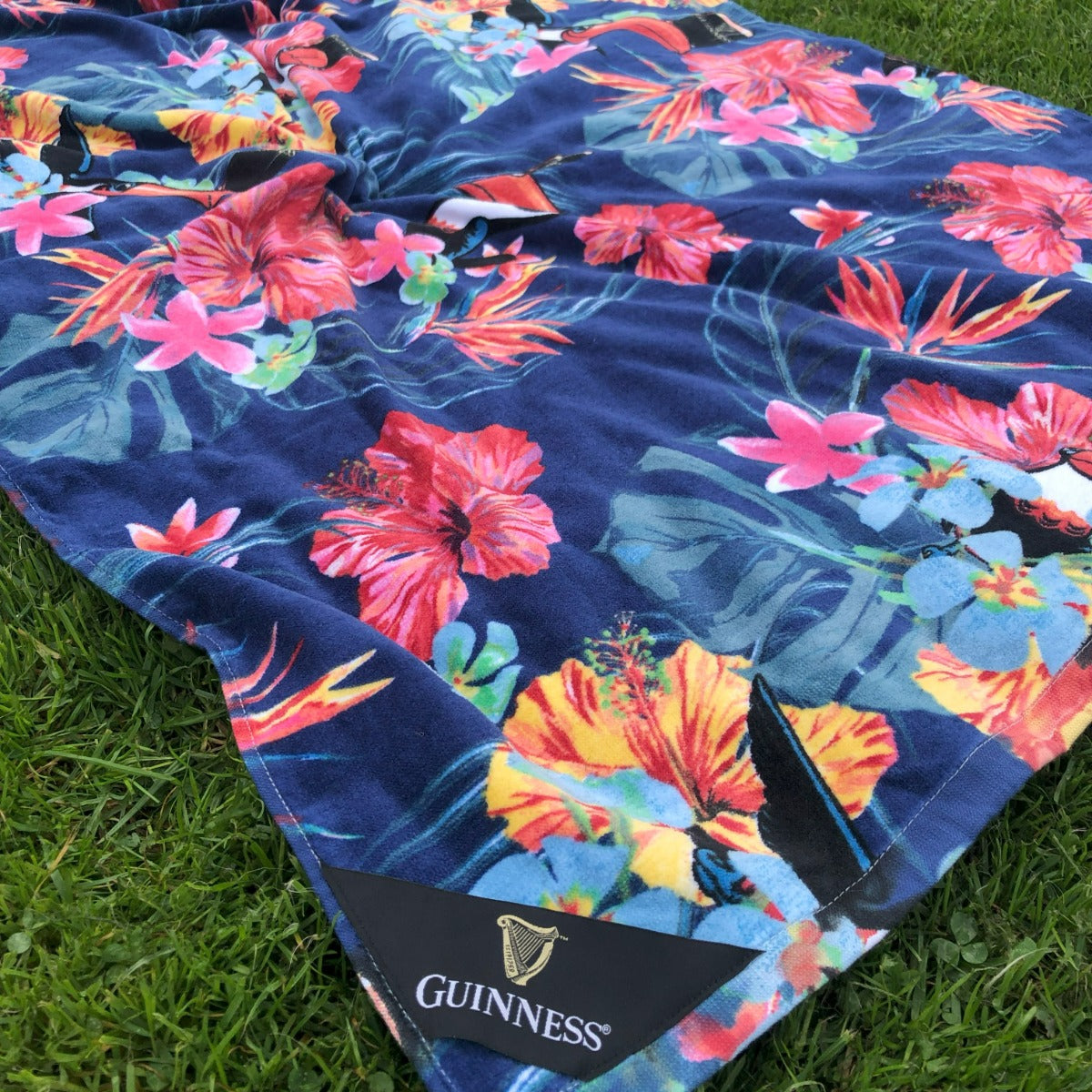 Guinness Toucan Hawaiian Beach Towel by Guinness UK, perfect for summer lounging.