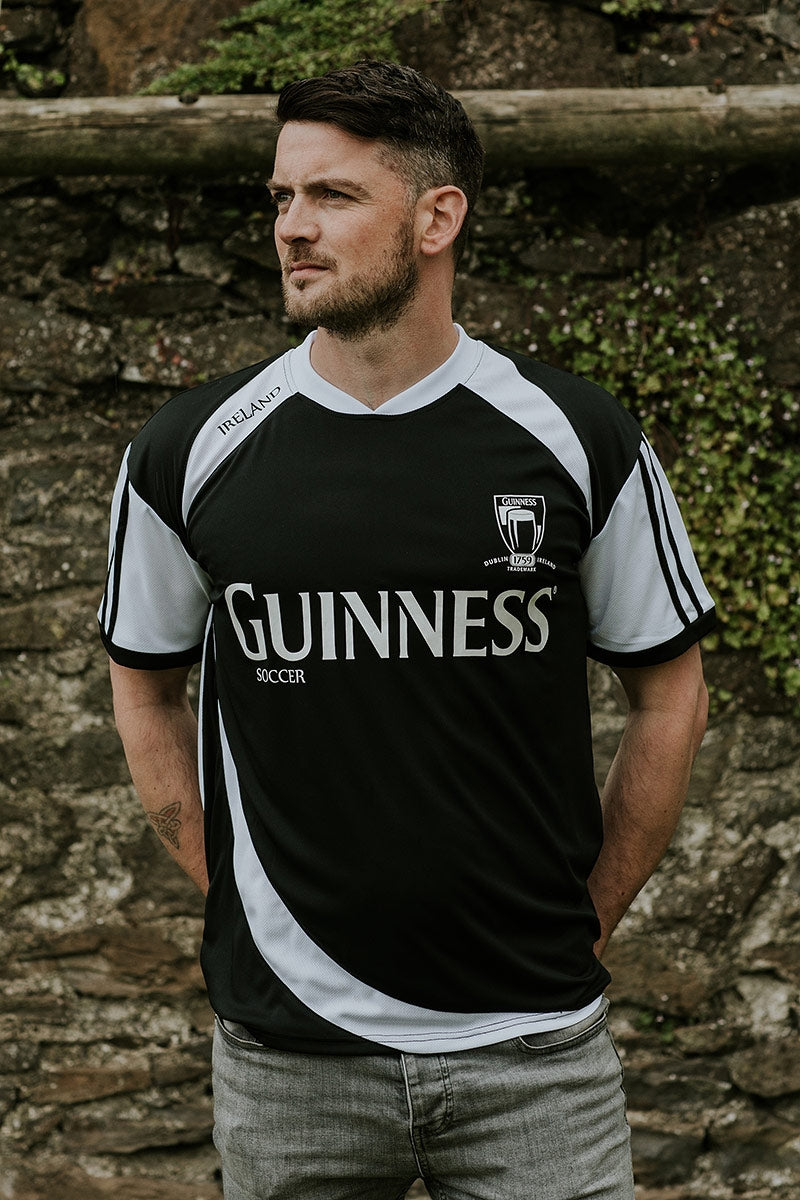 A man wearing a Guinness® Soccer Jersey.
