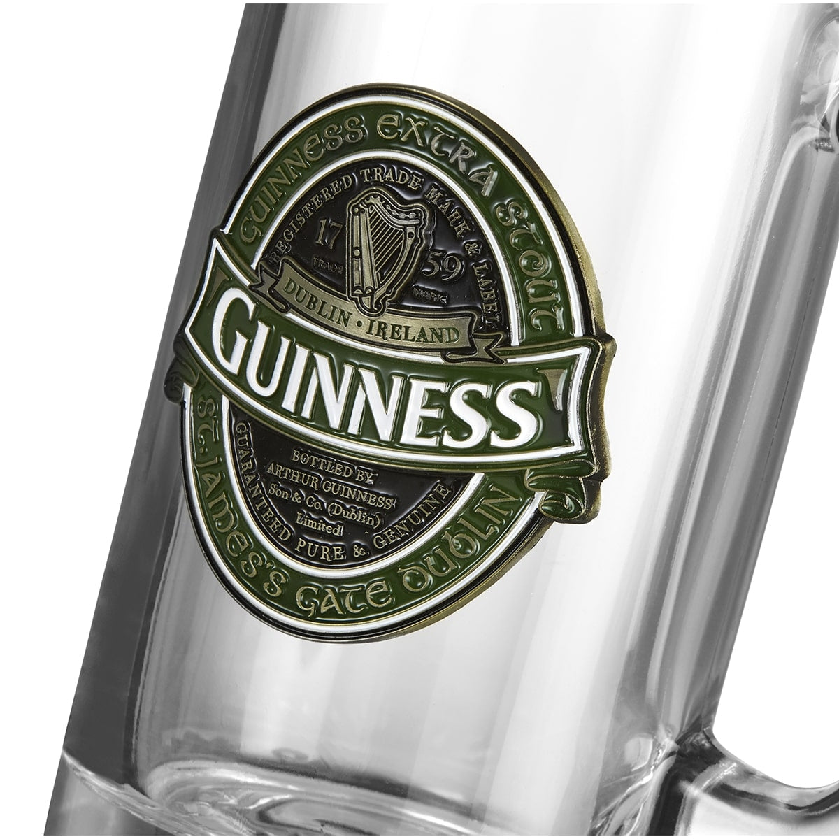 A close-up of a Guinness Ireland Tankard with the Guinness Extra Stout label, showcasing the detailed Guinness logo and text mentioning St. James's Gate, Dublin.