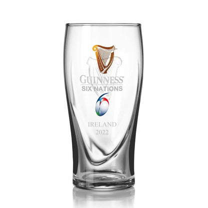 A Guinness UK Six Nations Pint Glass - 4 Pack with the Guinness survivor logo on it.