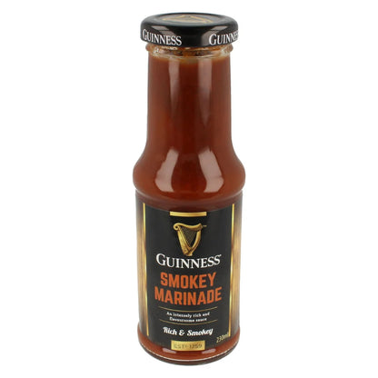 A 320ml bottle of Guinness Smokey Marinade Sauce from Guinness Webstore UK, labeled "Rich & Smokey," delivers a dark-colored sauce perfect for those who love complex flavors, making it an ideal gift for food enthusiasts.