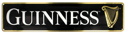 The Guinness UK Guinness Harp Metal Sign Landscape is a rectangular, durable metal sign with a black background that showcases the word "GUINNESS" in white text alongside the classic gold Guinness Harp symbol on the right, making it an ideal bar sign.