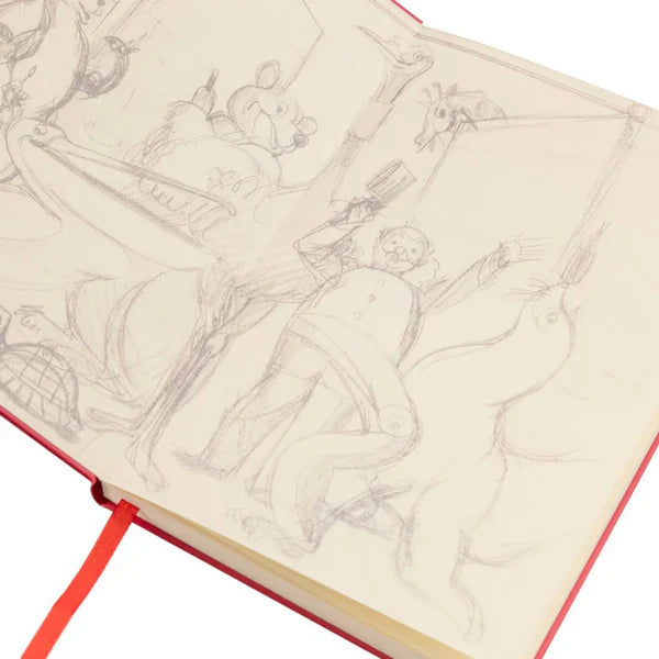 Pencil sketch of a man in a suit, alongside animals like a bear and seal, on an open Guinness Gilroy Toucan Notebook from Guinness Webstore UK with a red ribbon bookmark.